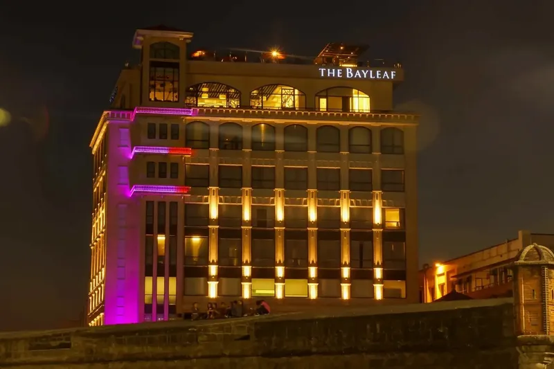 Night view of the Bayleaf Intramuros hotel within the walls of Manila old town