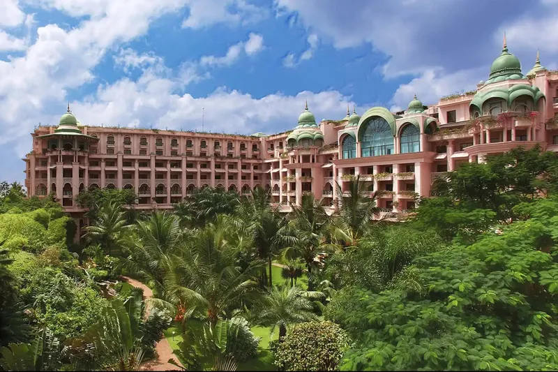 An overall view of gardens and building of The Leela Palace Bengaluru, India