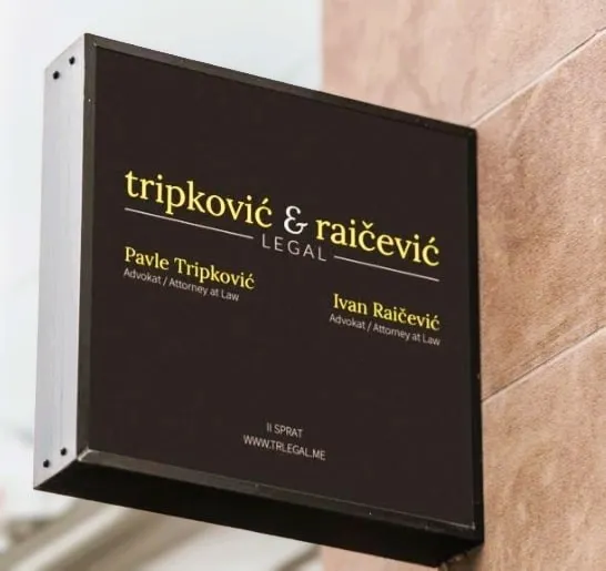 the sign for the tripkovich and raichevich law office in Podgorica, Montenegro
