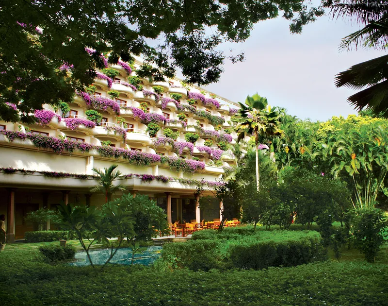 Lush vegetation and water bodies of the garden of the Oberoi Hotel in Bengaluru, India