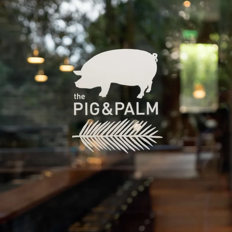 The logo of The Pig & Palm restaurant in Cebu, Philippines