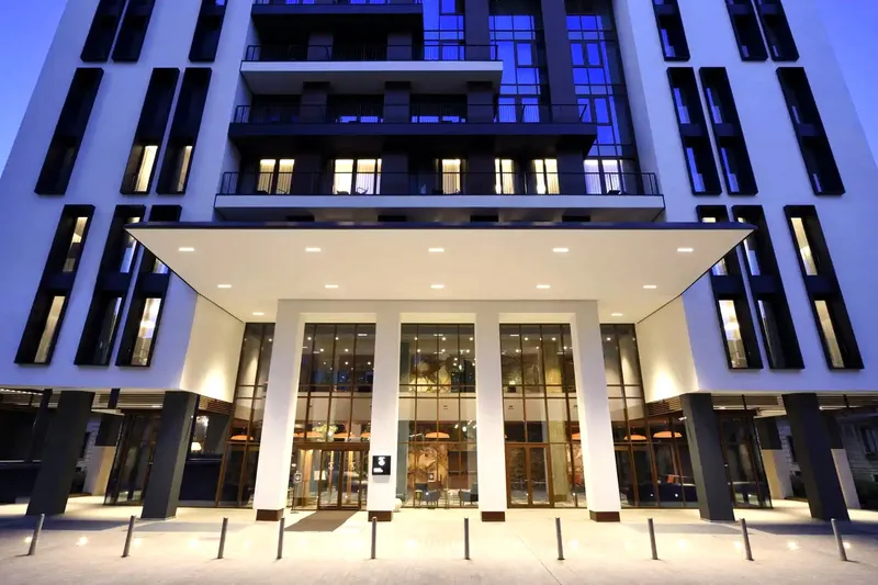 The modern building of the UNA Milano Verticale hotel 