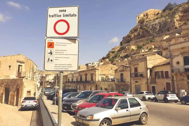 cars parked at the edge of a ZTL traffic restricted area in Sicily, Italy