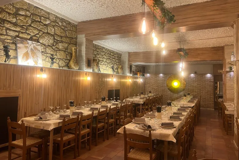 Tables set in the main dining area of the Beccafico restaurant and pizzeria in San Marino