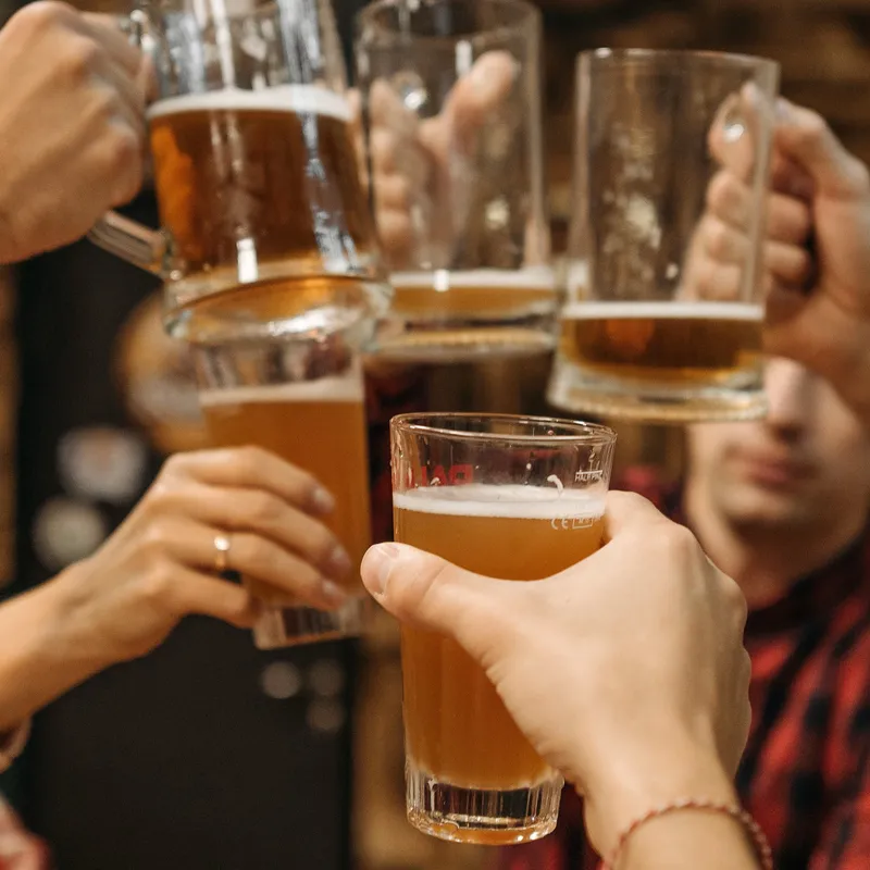 A toast with glasses of different tastes of beer