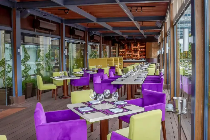 Raffaele restaurant tables on the veranda of the Bayleaf Hotel in Manila